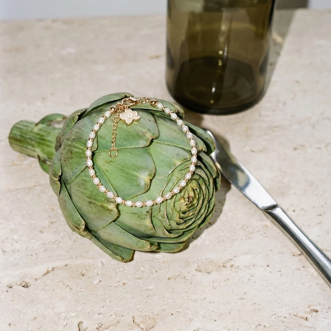 Creative shoot — a pearl bracelet on an artichoke