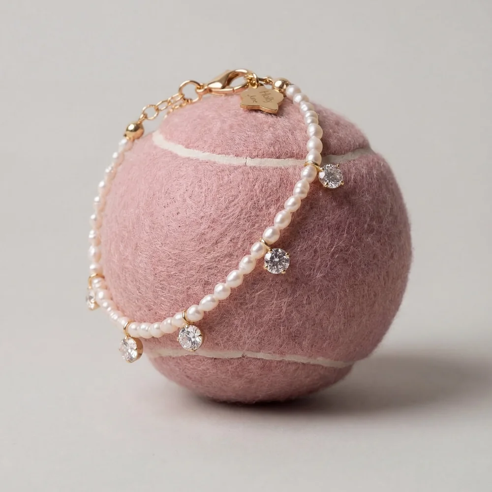 Creative shoot: a bracelet on a pink tennis ball