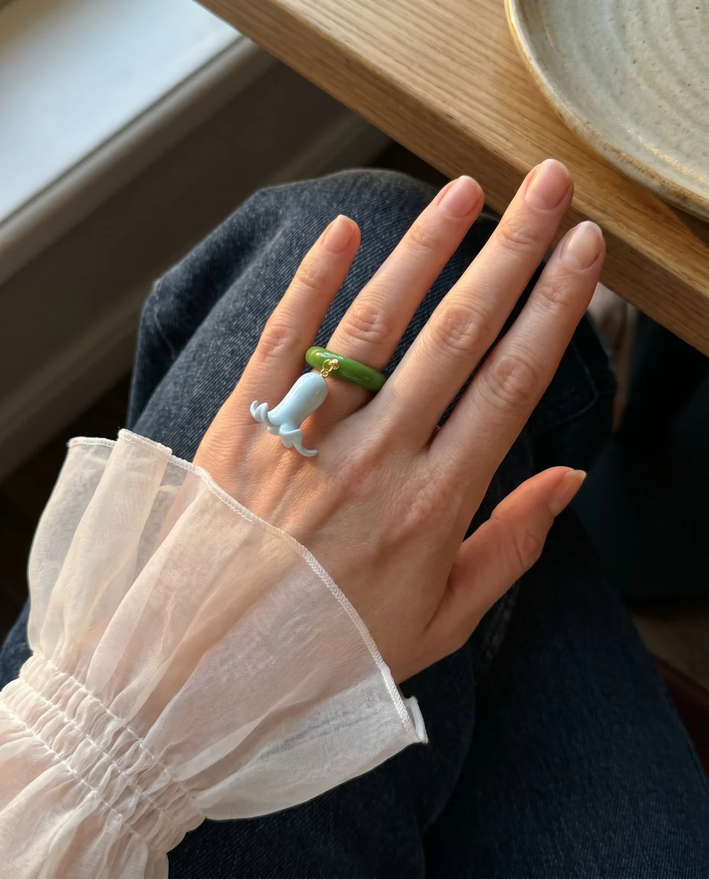Mobile shoot: hand wearing a ring, captured on a phone